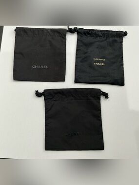 CHANEL lot of 3 black drawstring pouches dust bags, Sublimage beauty storage.